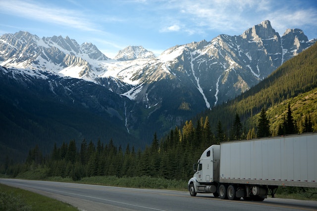 truck driving toward mountains