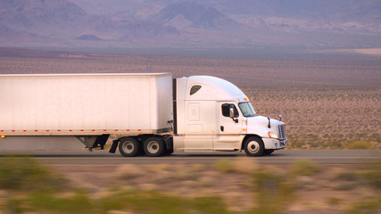 truck driving on 2 lane highway