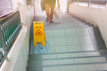 wet floor slip sign on staircase
