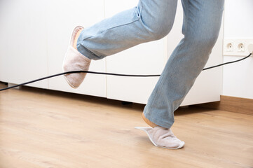 person tripping over wire
