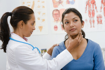 doctor examining woman